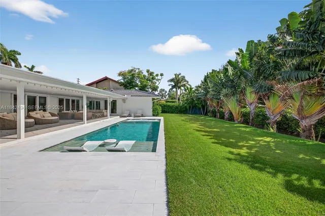 a view of house with a swimming pool