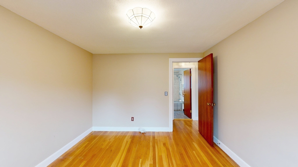 10 Wayland Road Wakefield, MA 01880 - Photo 16 of 28 a view of a room with wooden floor and a balcony