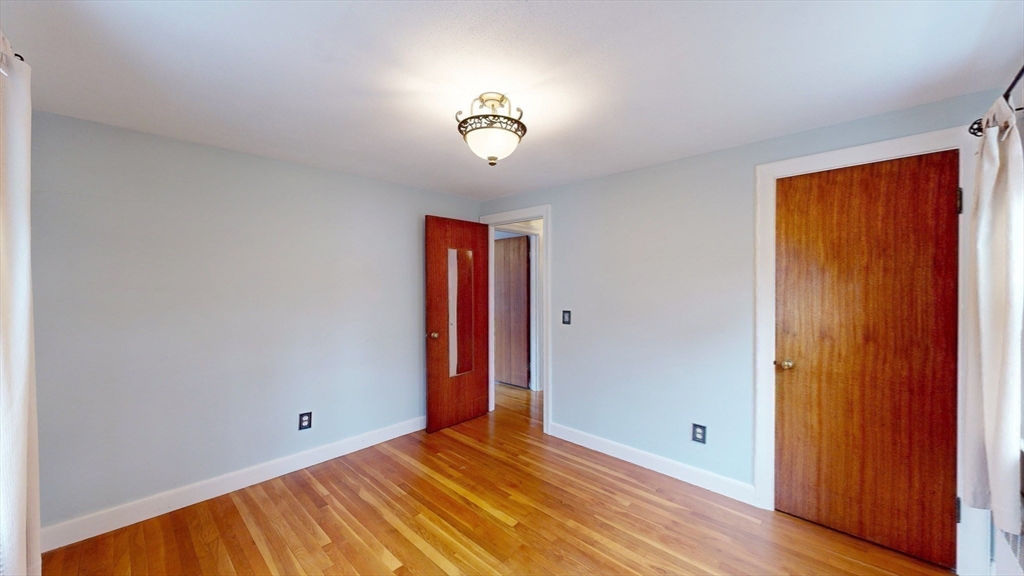 10 Wayland Road Wakefield, MA 01880 - Photo 18 of 28 a view of an empty room with a window