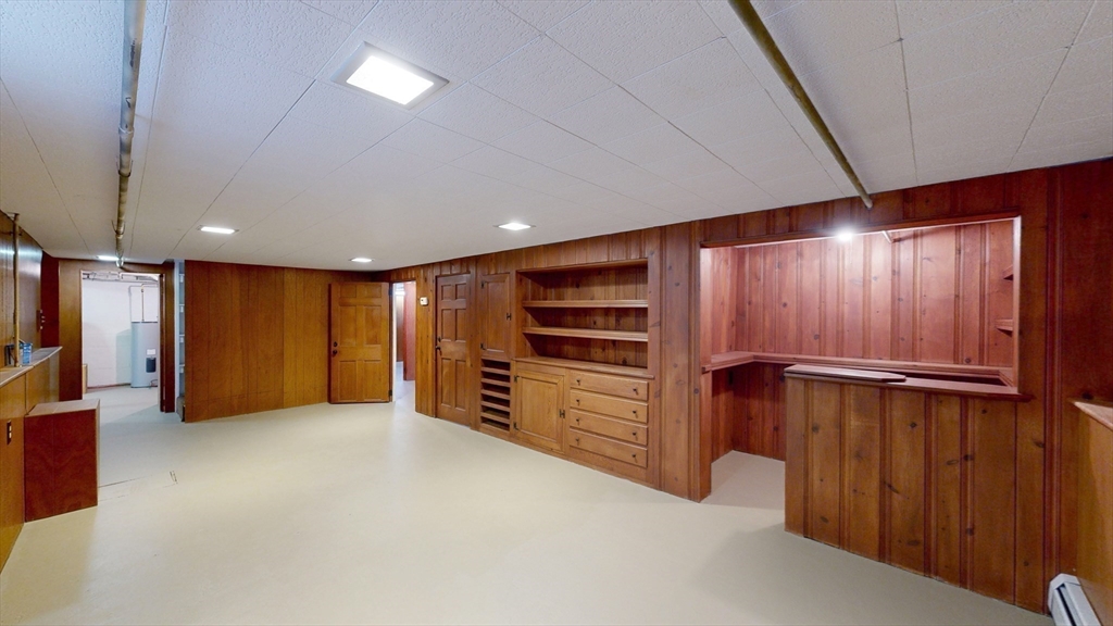 10 Wayland Road Wakefield, MA 01880 - Photo 23 of 28 an empty room with furniture closet and windows