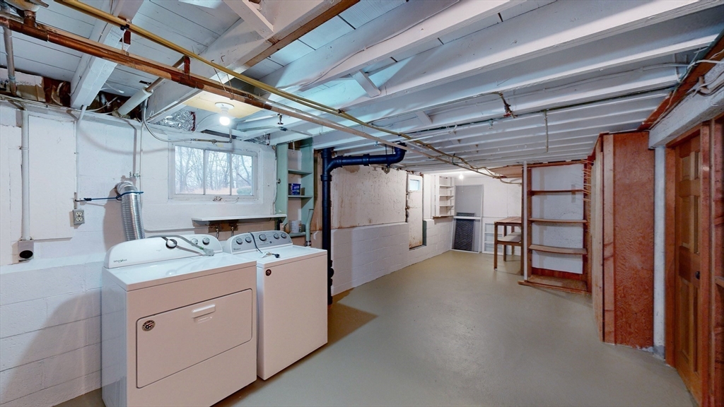 10 Wayland Road Wakefield, MA 01880 - Photo 24 of 28 a utility room with cabinets dryer and washer