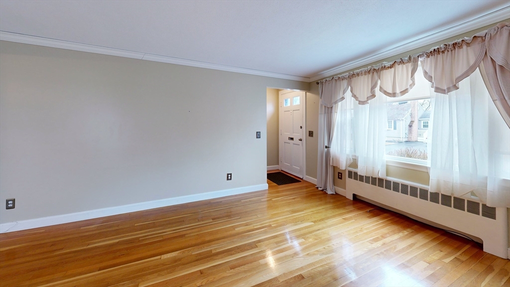 10 Wayland Road Wakefield, MA 01880 - Photo 6 of 28 a view of an empty room with window