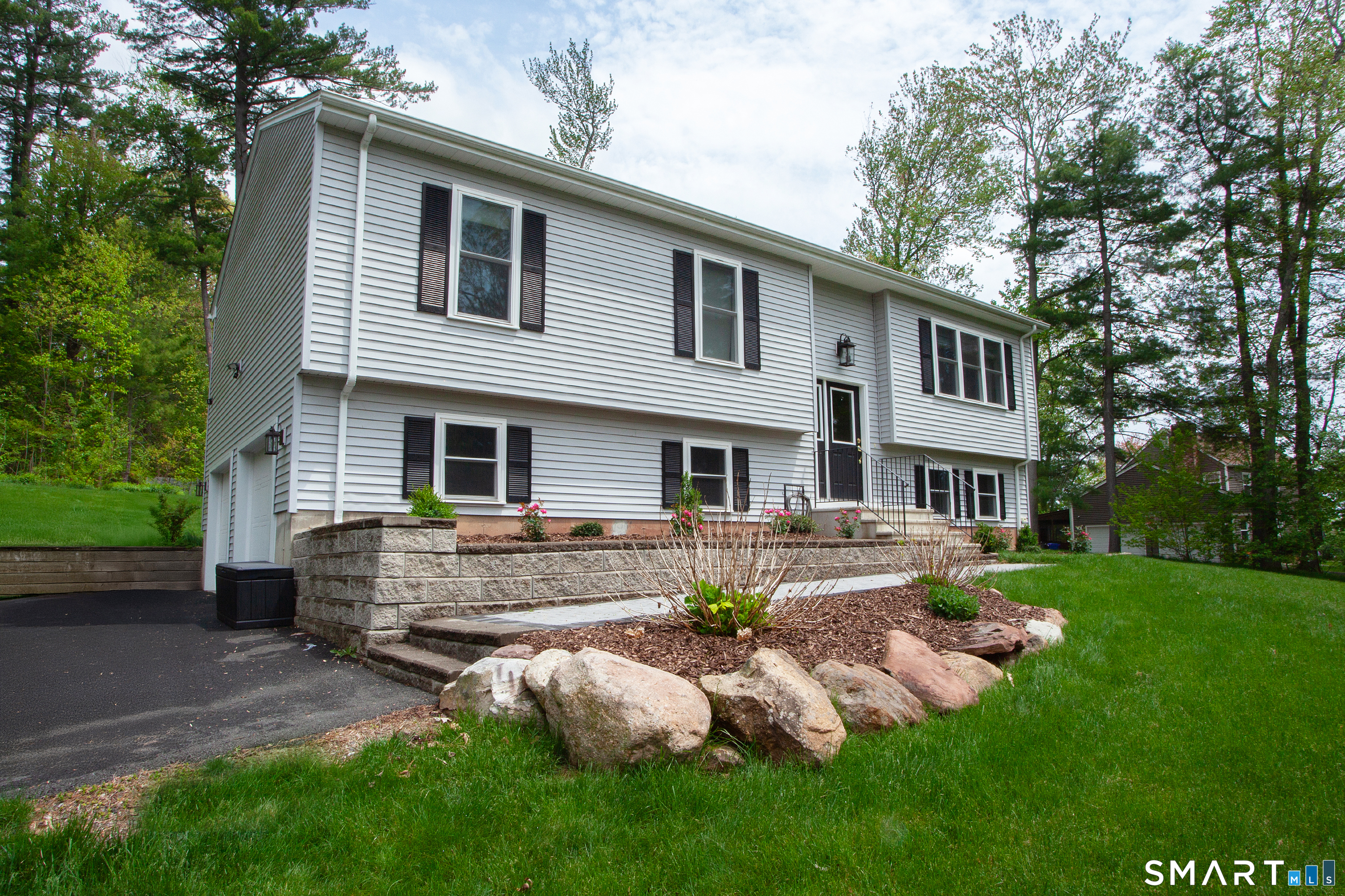 93 Rye Hill Circle Somers, CT 06071 - Photo 2 of 33 a front view of house with yard and outdoor seating