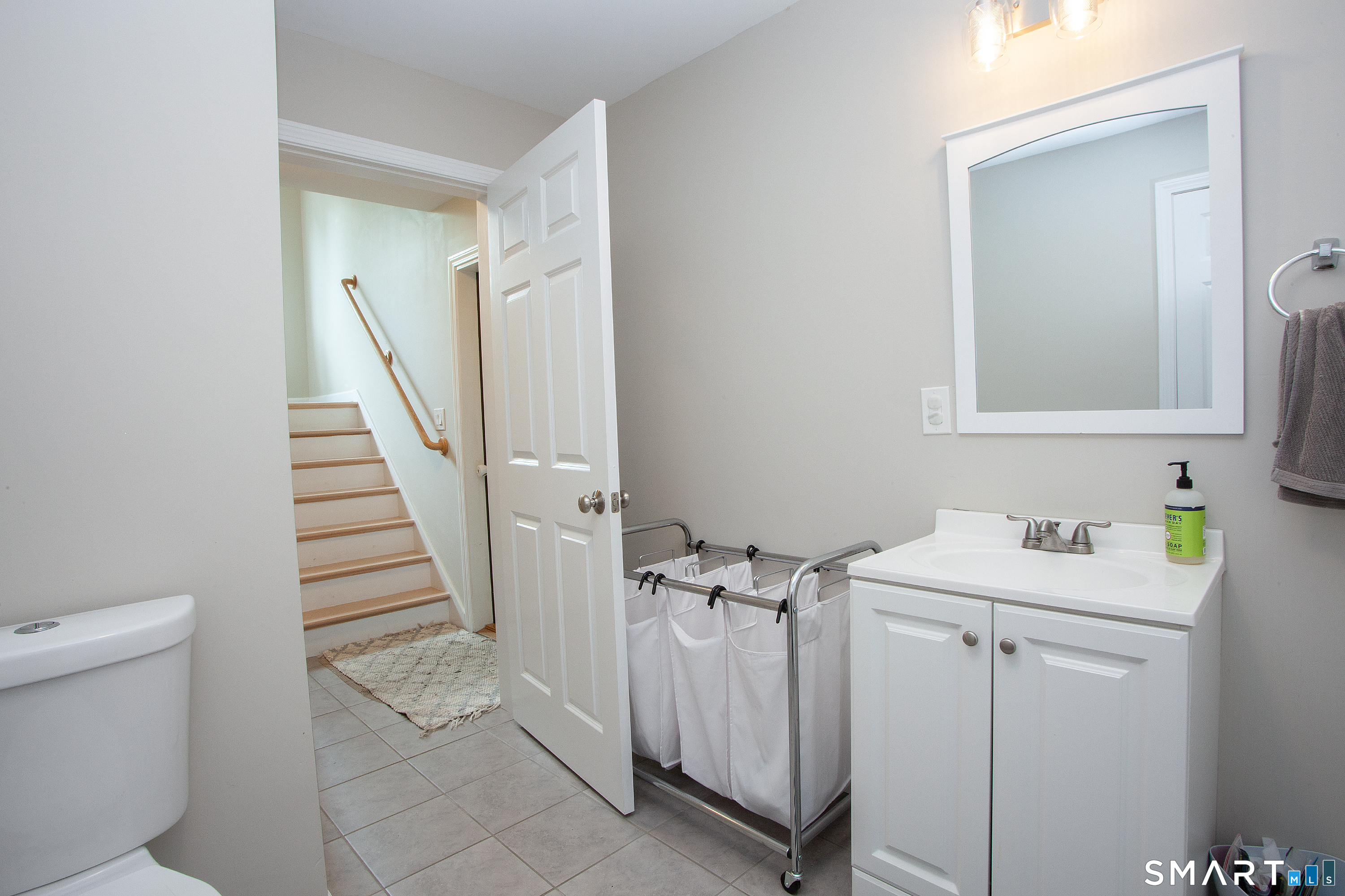 93 Rye Hill Circle Somers, CT 06071 - Photo 33 of 33 a bathroom with a sink a toilet and a mirror