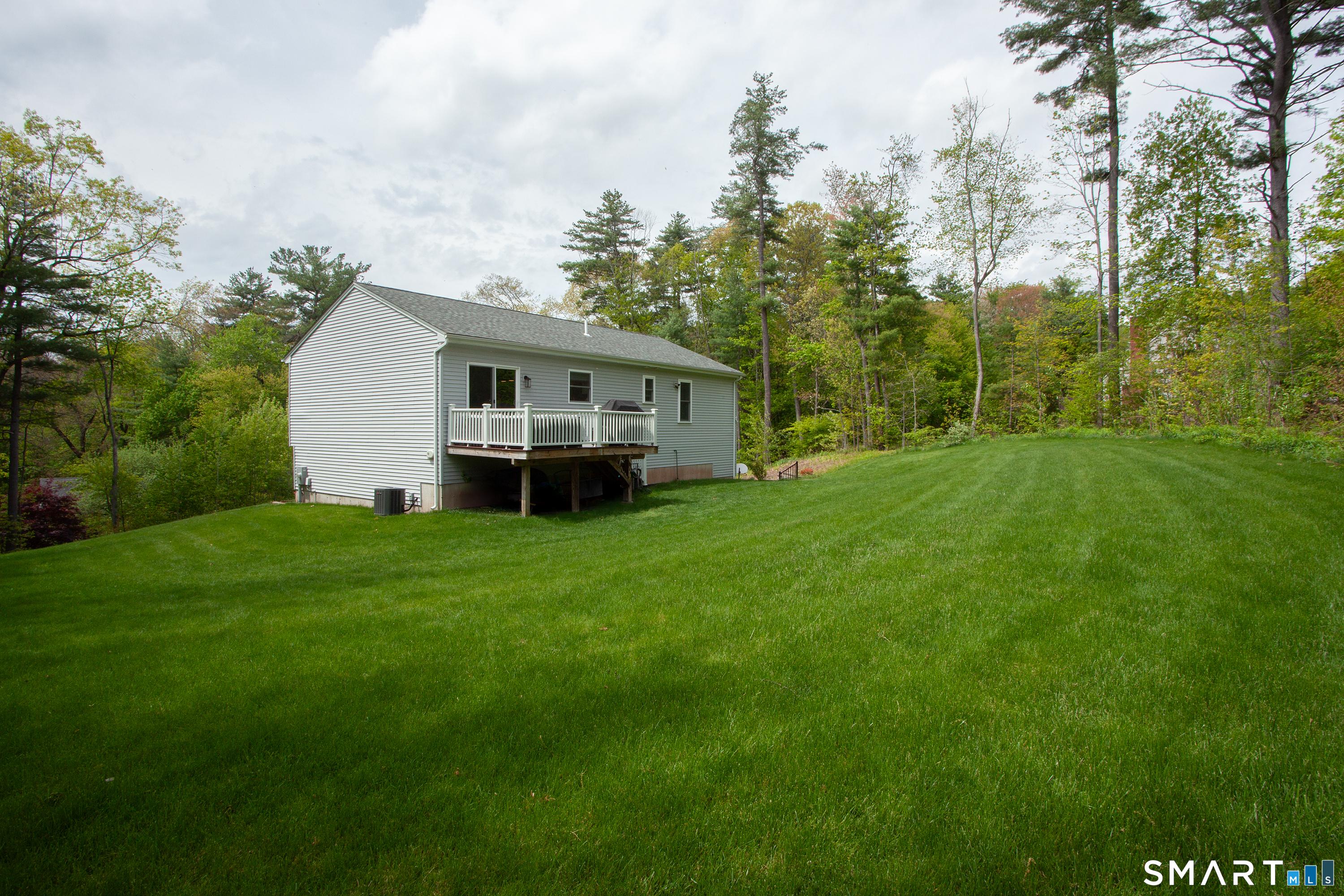93 Rye Hill Circle Somers, CT 06071 - Photo 4 of 33 a front view of a house with garden