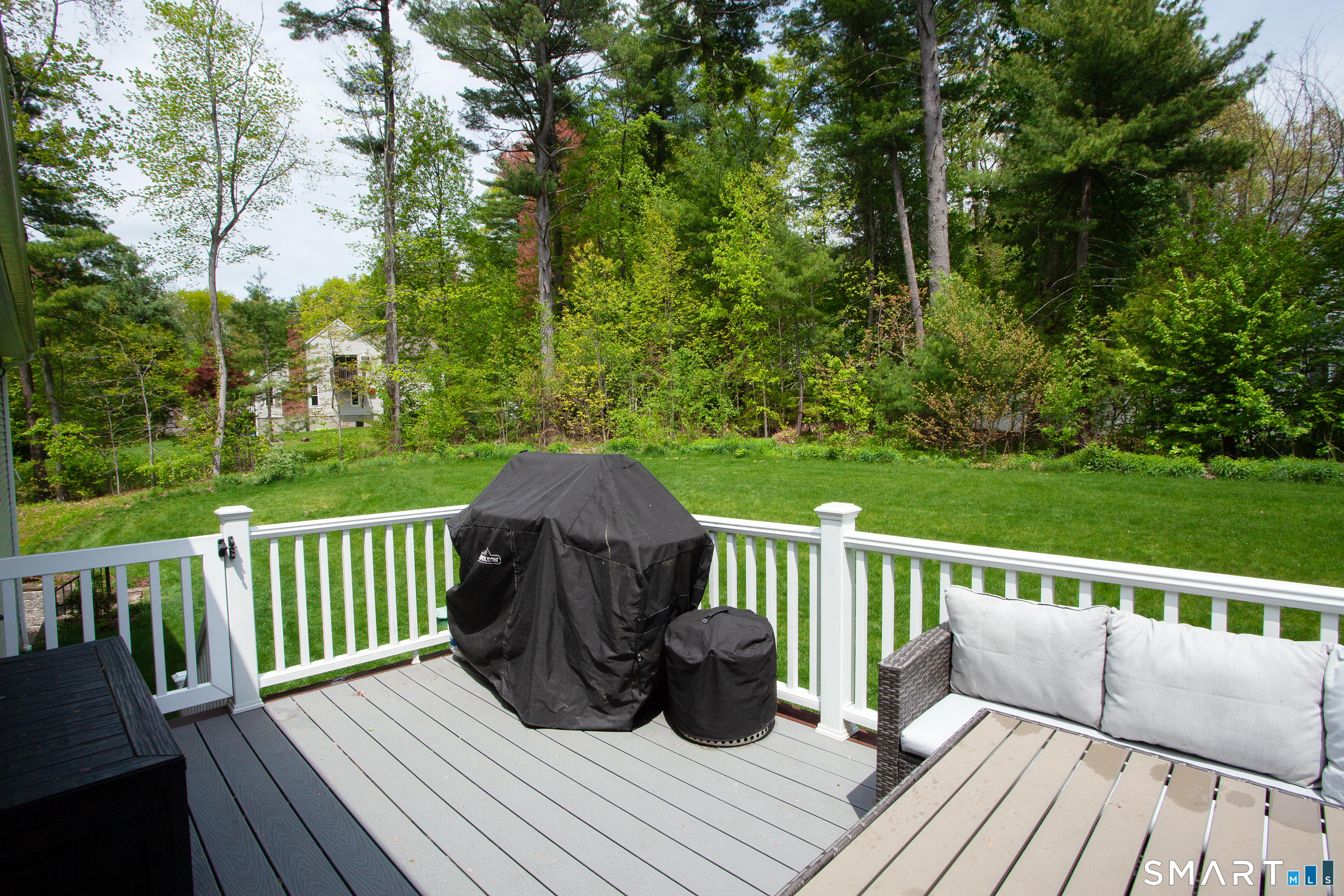 93 Rye Hill Circle Somers, CT 06071 - Photo 6 of 33 a view of a wooden deck with a bench