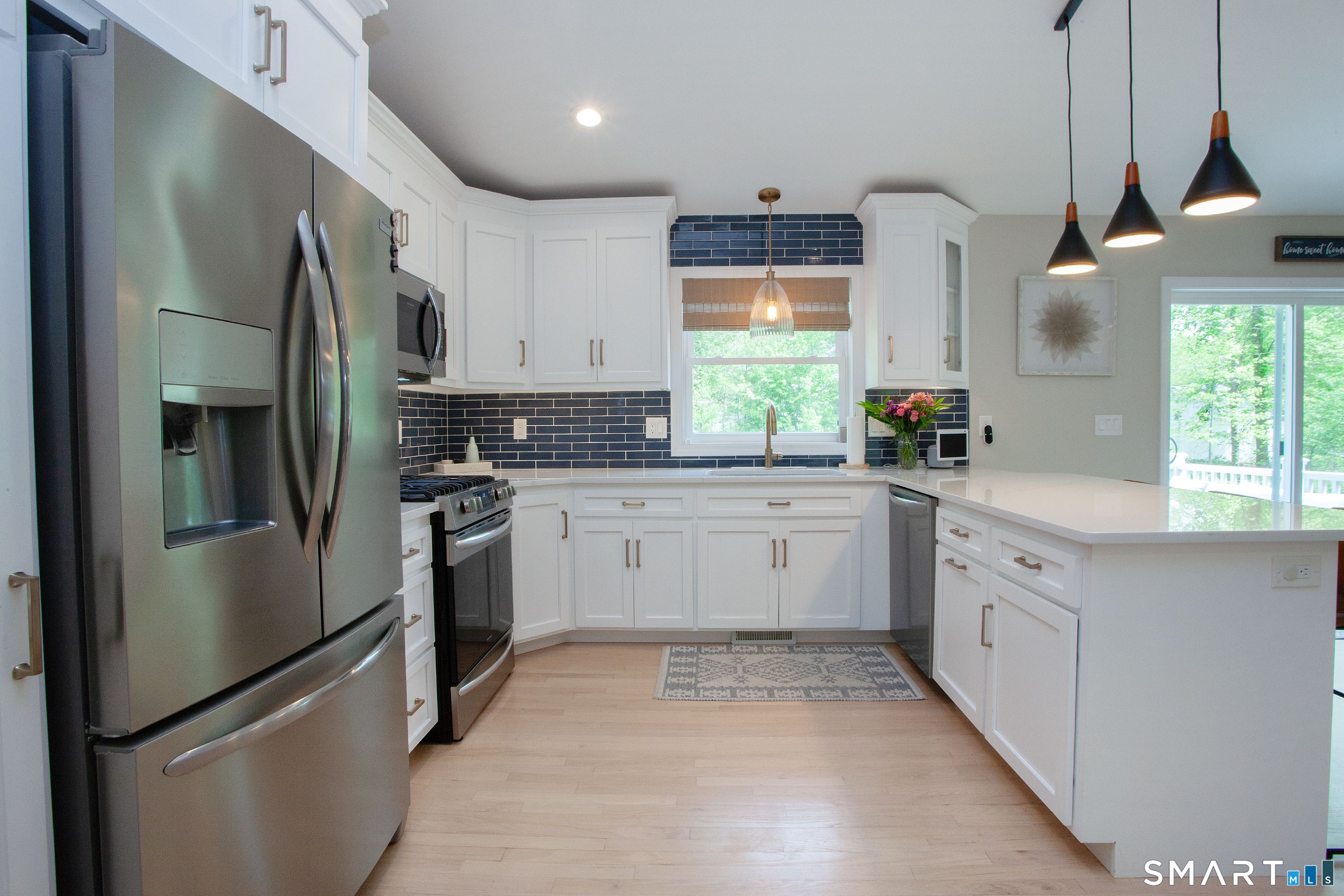 93 Rye Hill Circle Somers, CT 06071 - Photo 10 of 33 a kitchen with stainless steel appliances a refrigerator sink and cabinets