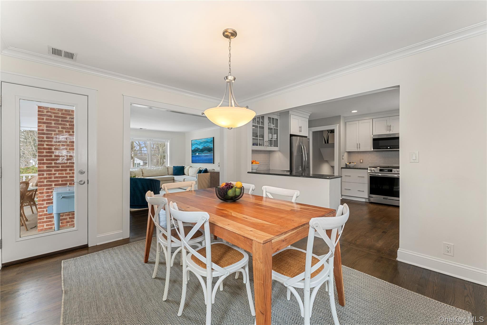 20 Riverview Road Irvington, NY 10533 - Photo 11 of 37 a view of a dining room with furniture window and wooden floor