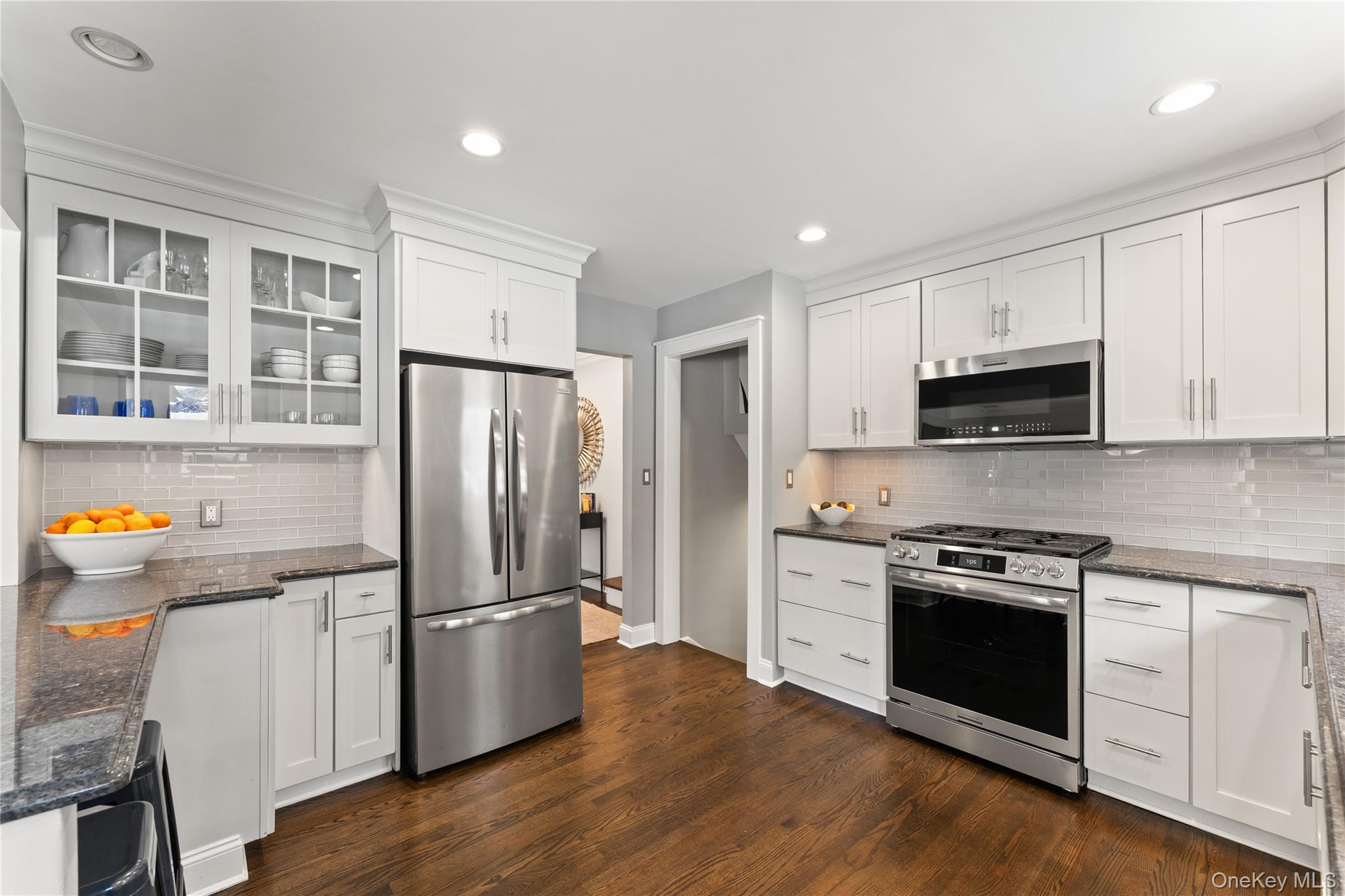 20 Riverview Road Irvington, NY 10533 - Photo 14 of 37 a kitchen with stainless steel appliances granite countertop a refrigerator stove and wooden cabinets