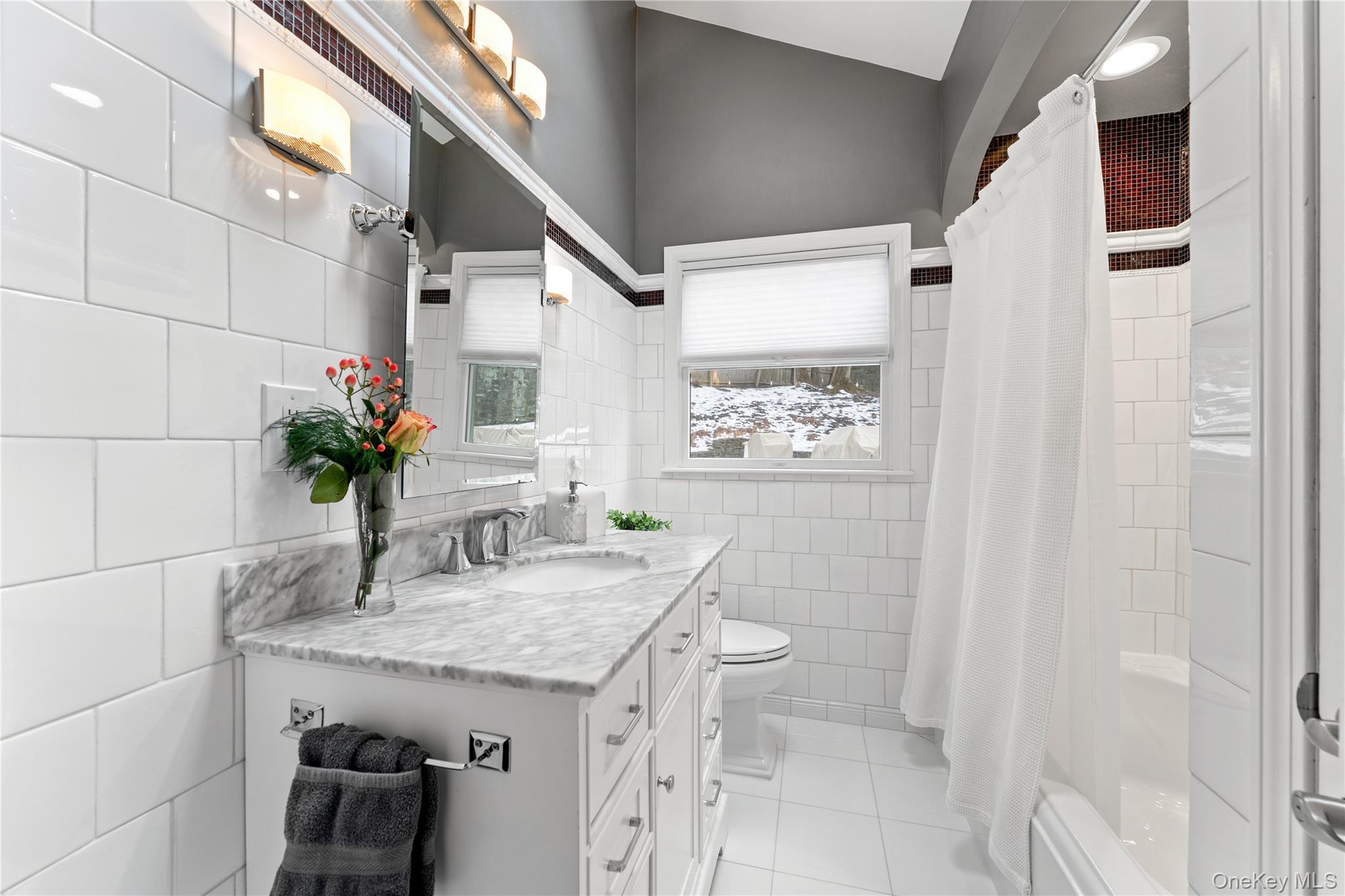 20 Riverview Road Irvington, NY 10533 - Photo 16 of 37 a bathroom with a granite countertop sink a toilet and a mirror