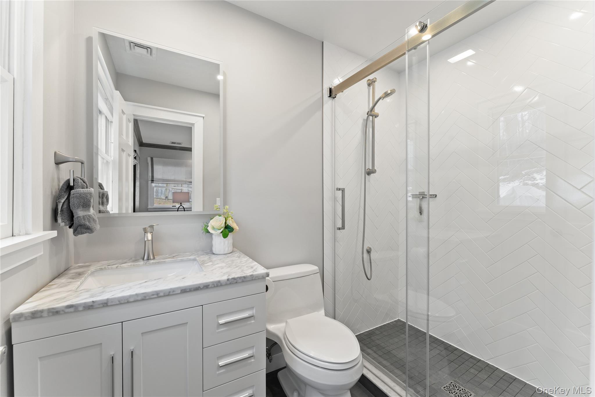 20 Riverview Road Irvington, NY 10533 - Photo 22 of 37 a bathroom with a granite countertop sink toilet and shower