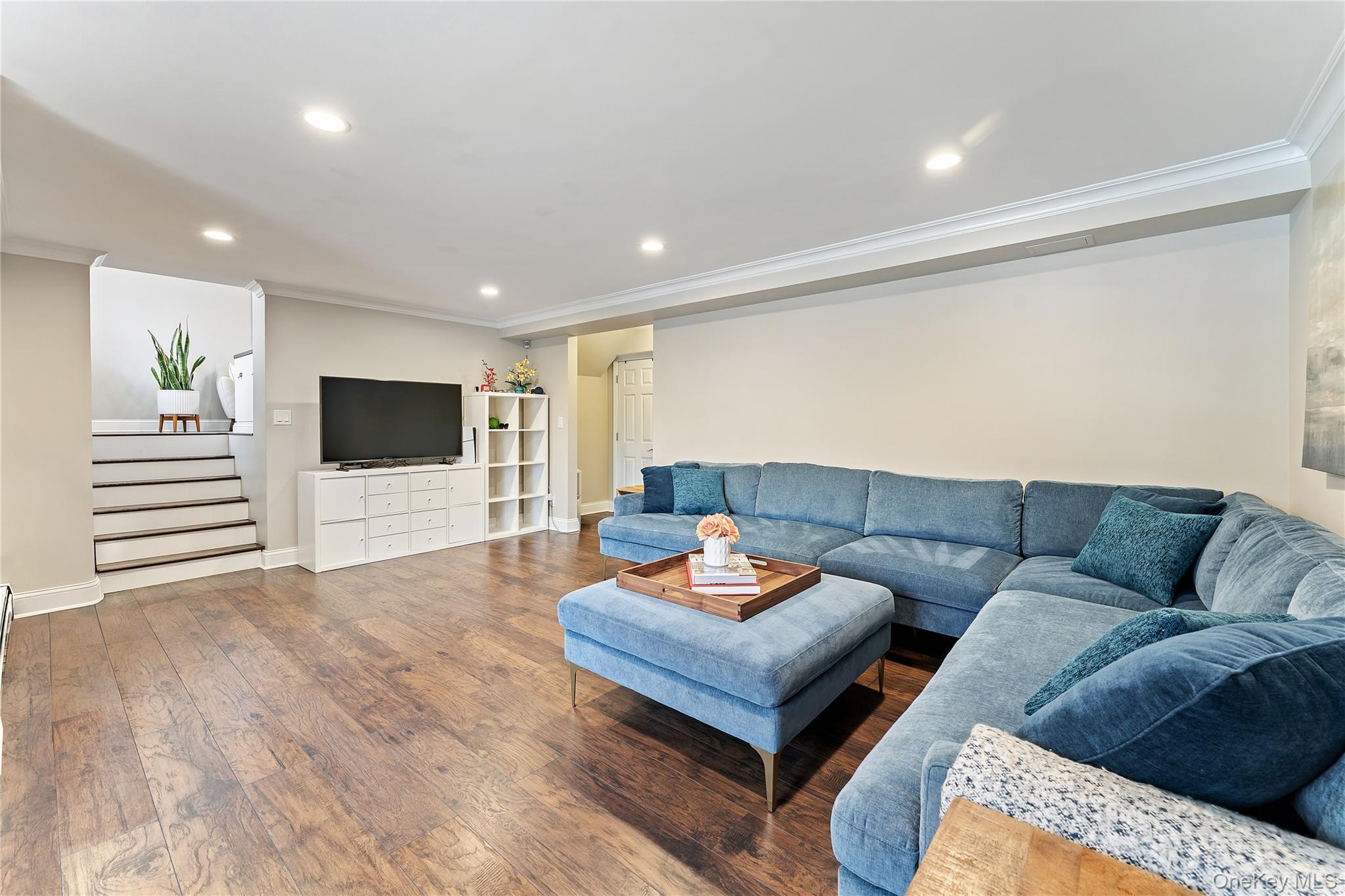 20 Riverview Road Irvington, NY 10533 - Photo 26 of 37 a living room with furniture and a flat screen tv