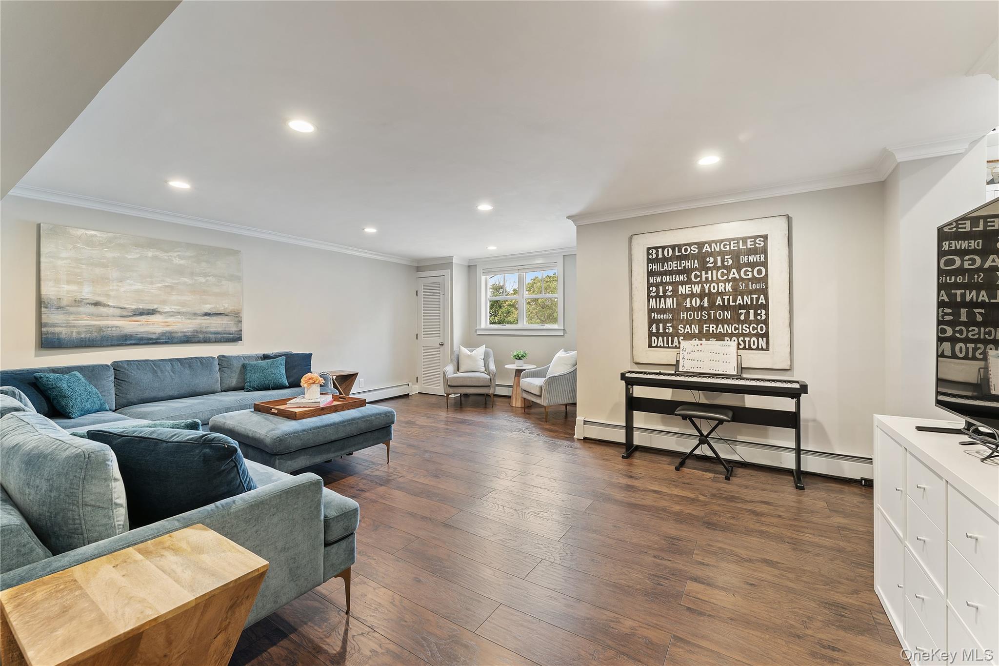 20 Riverview Road Irvington, NY 10533 - Photo 27 of 37 a living room with furniture and a wooden floor