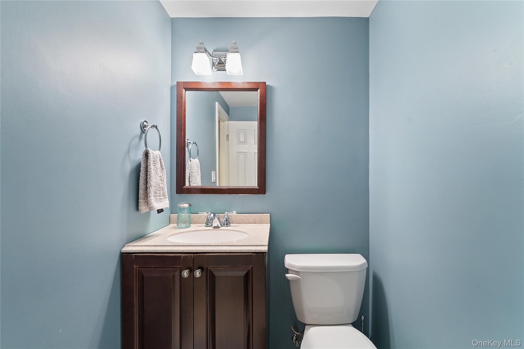 20 Riverview Road Irvington, NY 10533 - Photo 28 of 37 a bathroom with a toilet sink and mirror