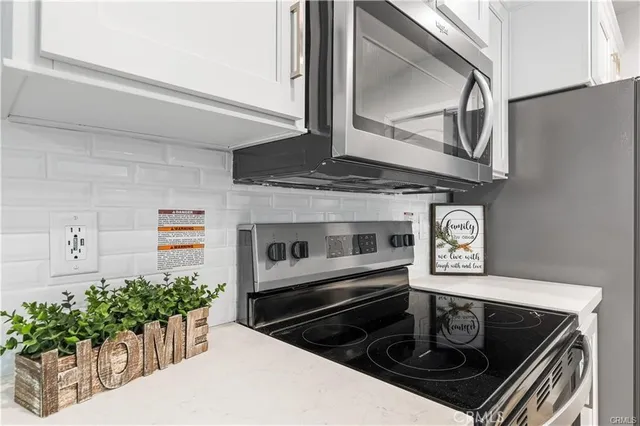 a kitchen with stove and flowers