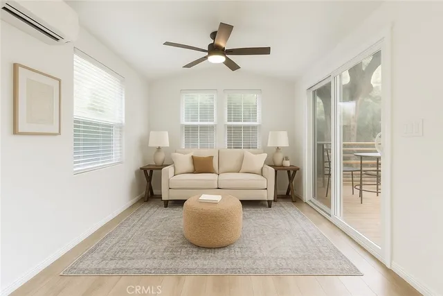 a living room with furniture and a window