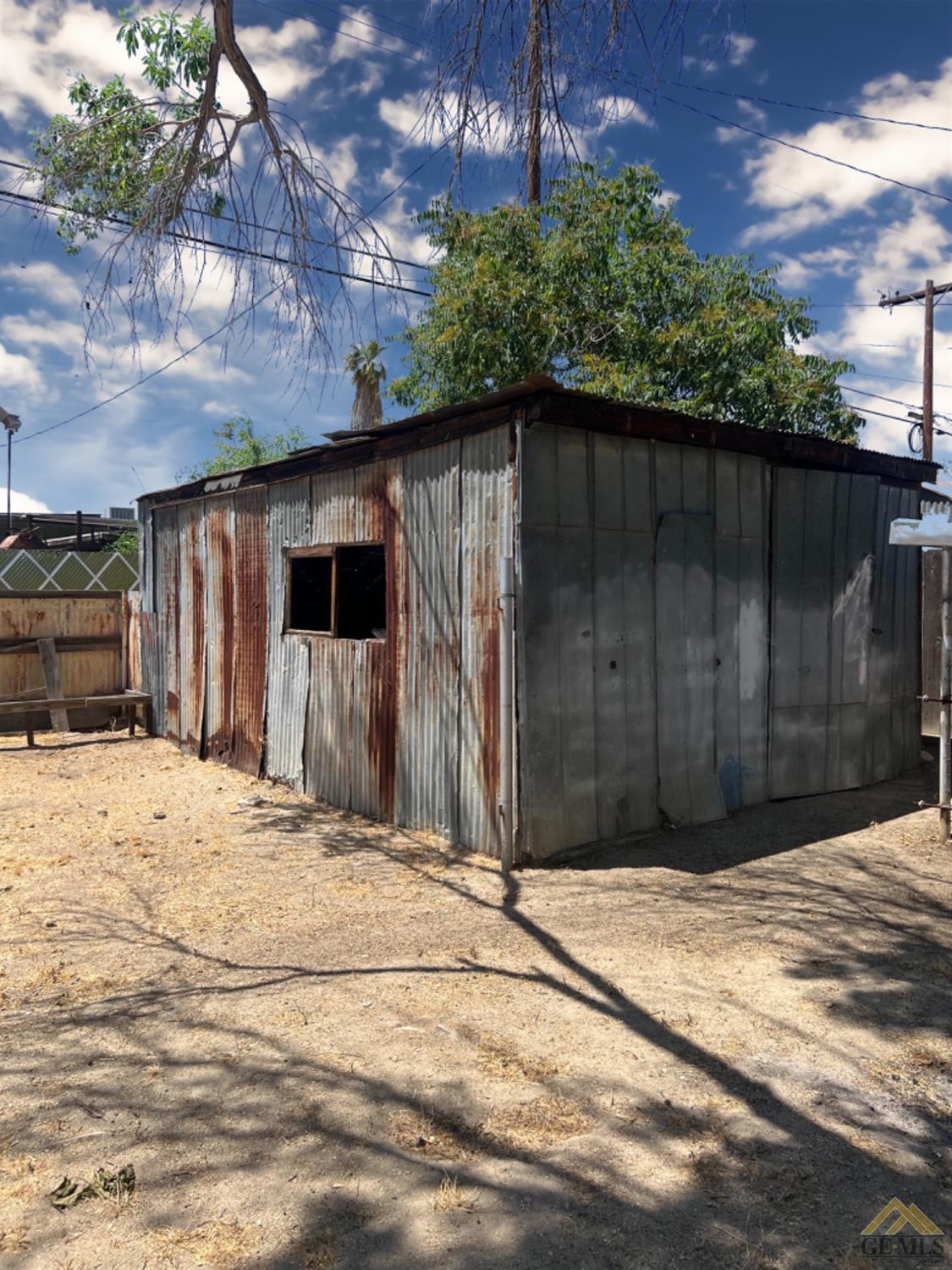 Undisclosed Address Taft, CA 93268 - Photo 17 of 18 a front view of a house having yard