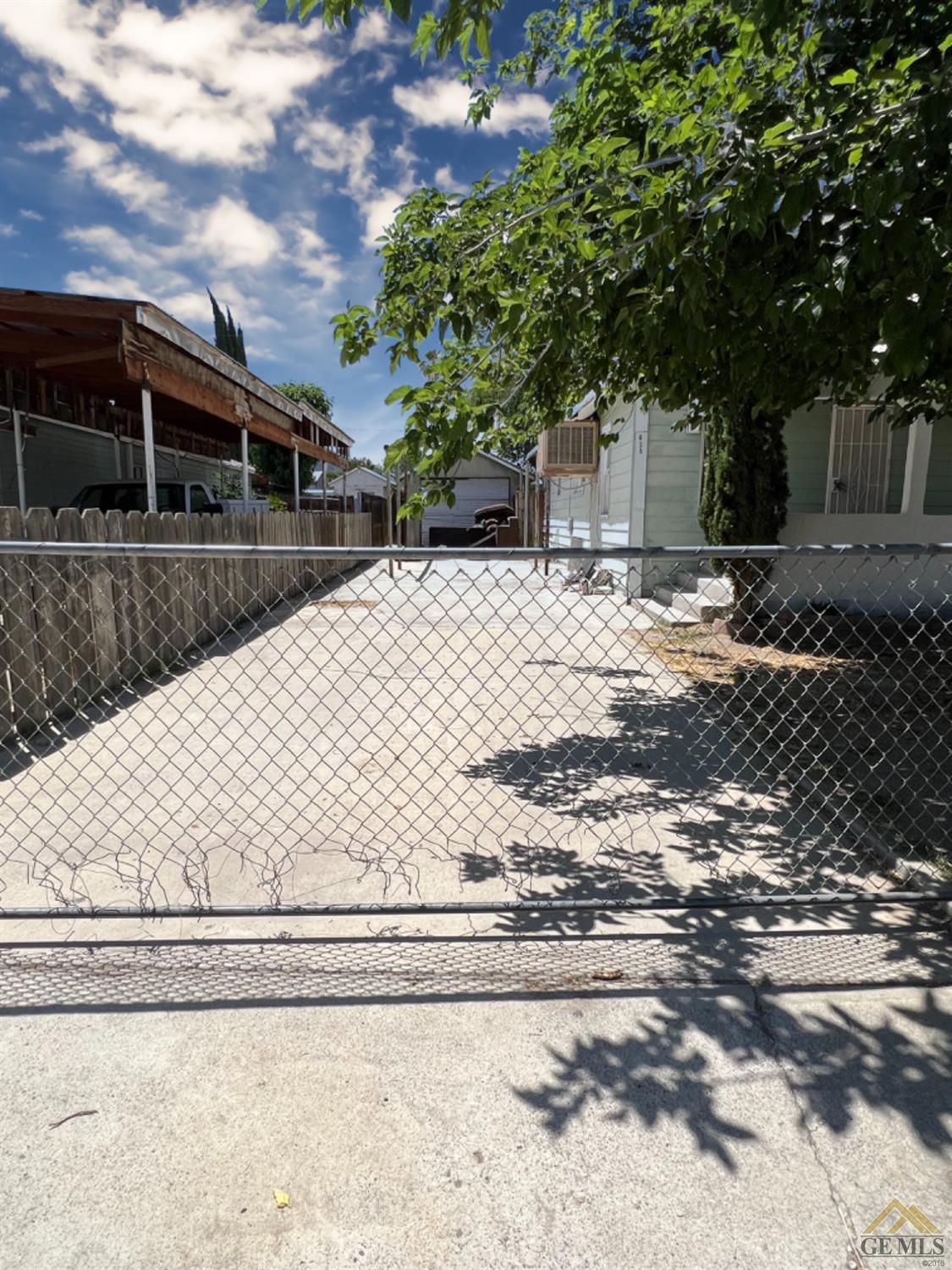 Undisclosed Address Taft, CA 93268 - Photo 3 of 18 a front view of house with yard