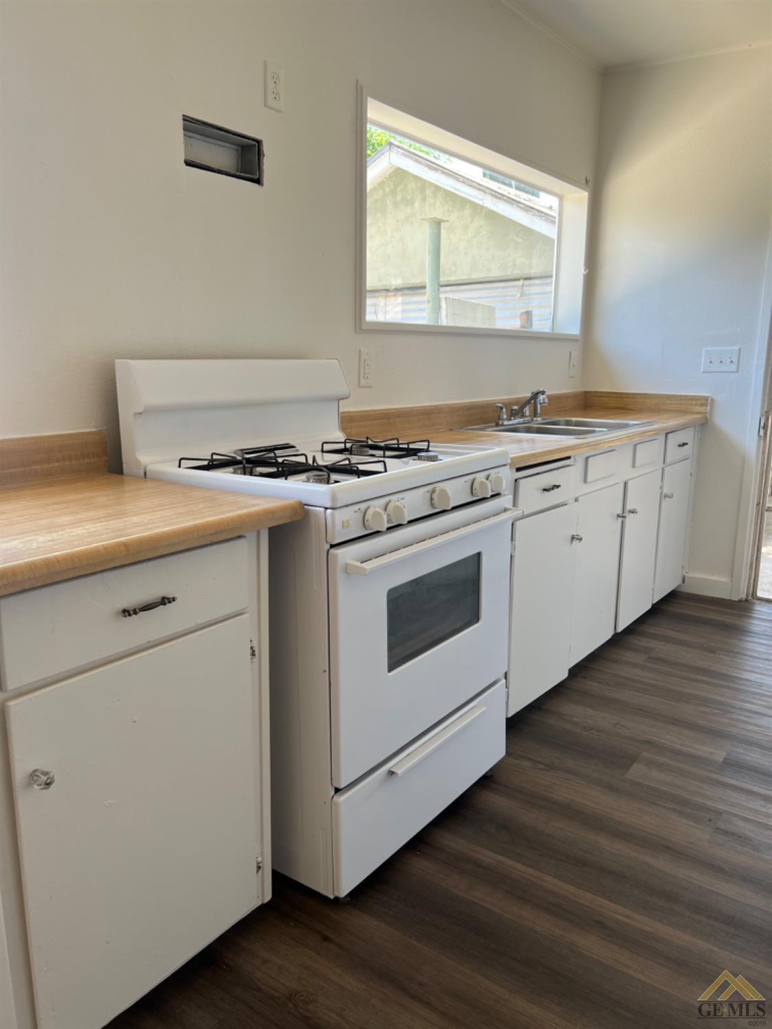 Undisclosed Address Taft, CA 93268 - Photo 10 of 18 a white stove top oven sitting inside of a kitchen