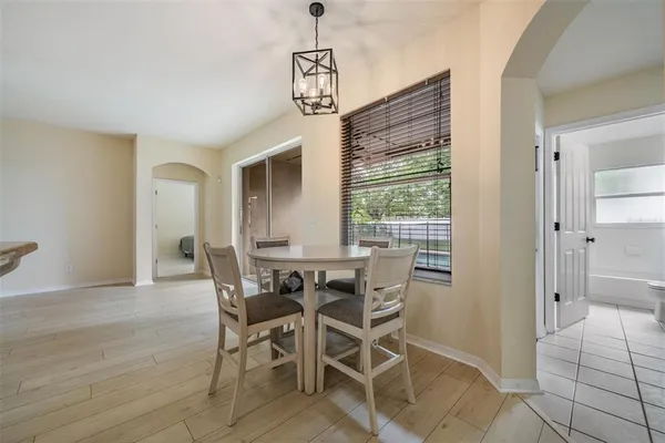 a dining room with furniture and window