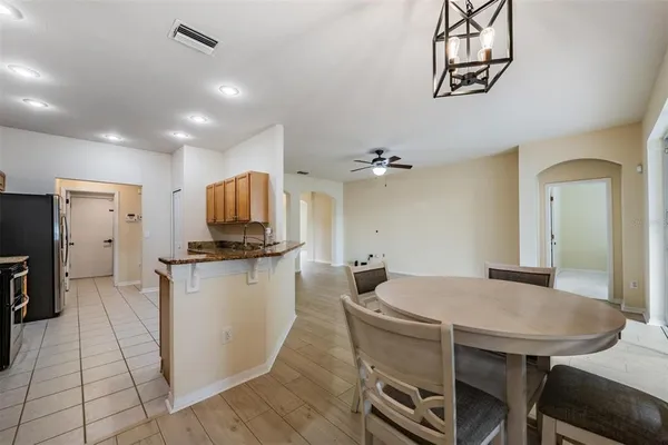 a kitchen with a table and chairs