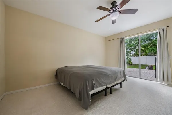 a bed sitting in a room next to a window