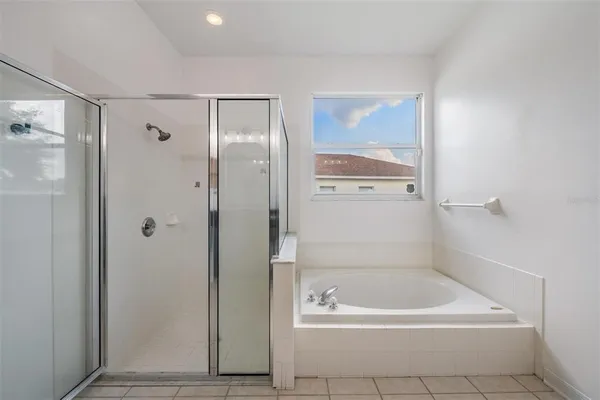 a bathroom with a bath tub and a shower