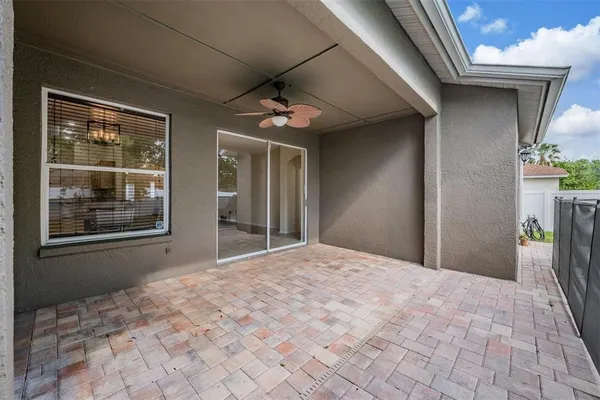 a view of empty room with windows and wardrobe