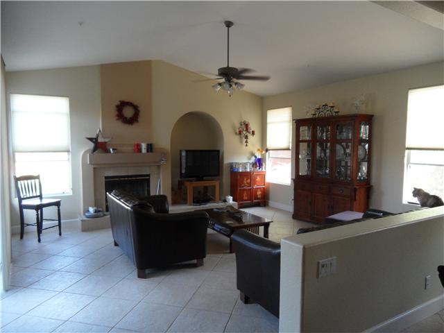 16807 Open View Road Ramona, CA 92065 - Photo 3 of 18 Family room with fireplace and sliders out to backyard.