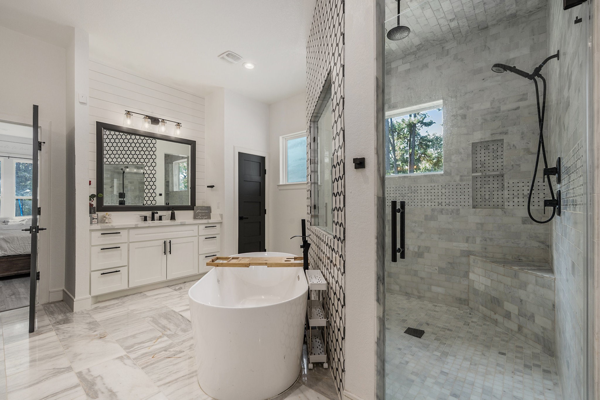 11211 Leonidas Horton Road Conroe, TX 77304 - Photo 16 of 47 Another view of this showstopping en suite with a large walk-in shower with dual shower heads for a true spa feel.
