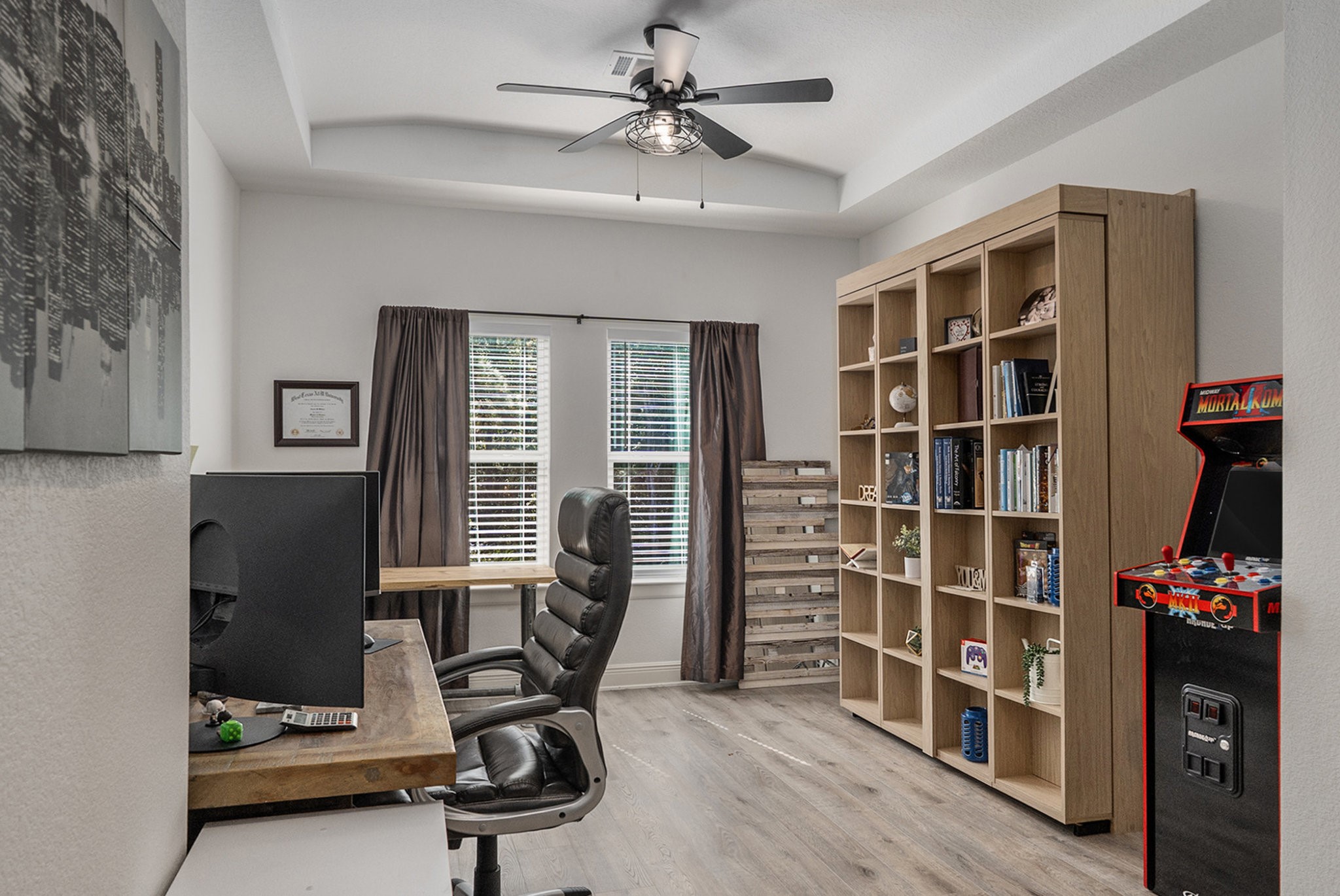 11211 Leonidas Horton Road Conroe, TX 77304 - Photo 29 of 47 Secondary bedrooms features a custom Murphy bed, offering flexible space that easily transforms from a cozy guest room to a productive home office.
