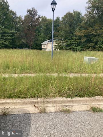 a backyard of a house with a yard and outdoor seating
