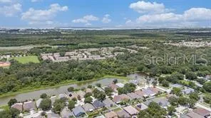 an aerial view of a houses with outdoor space