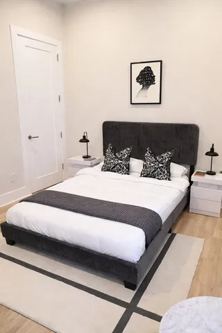 a bedroom with a bed and a couch