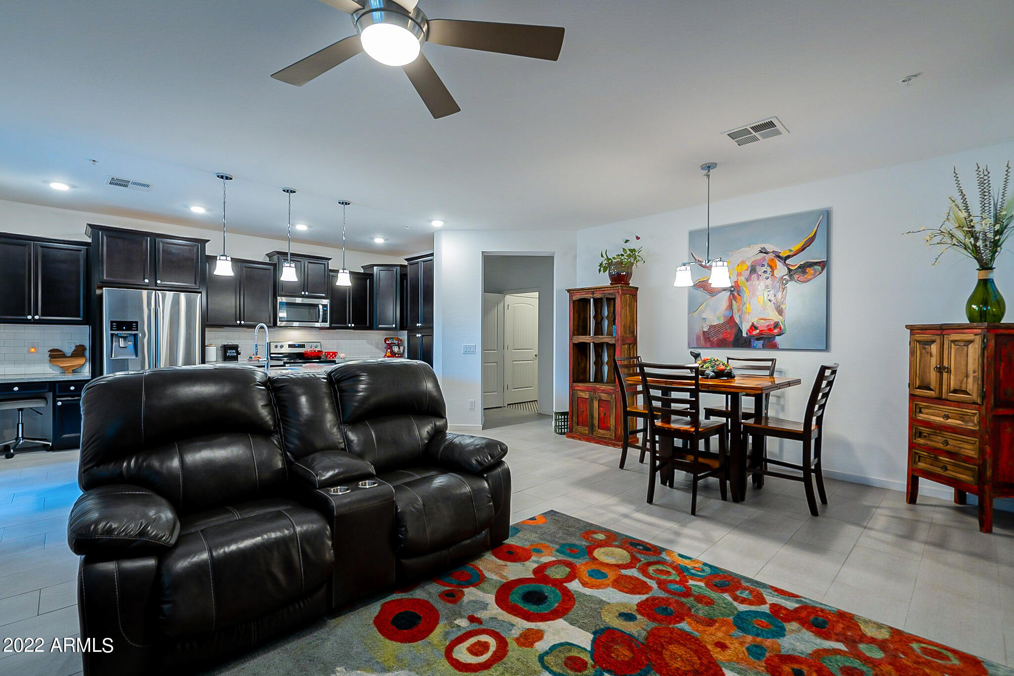 3900 East Baseline Road, Unit 142 Phoenix, AZ 85042 - Photo 12 of 28 a living room with furniture and a dining table
