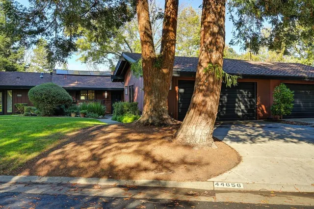 a view of a house with basketball court
