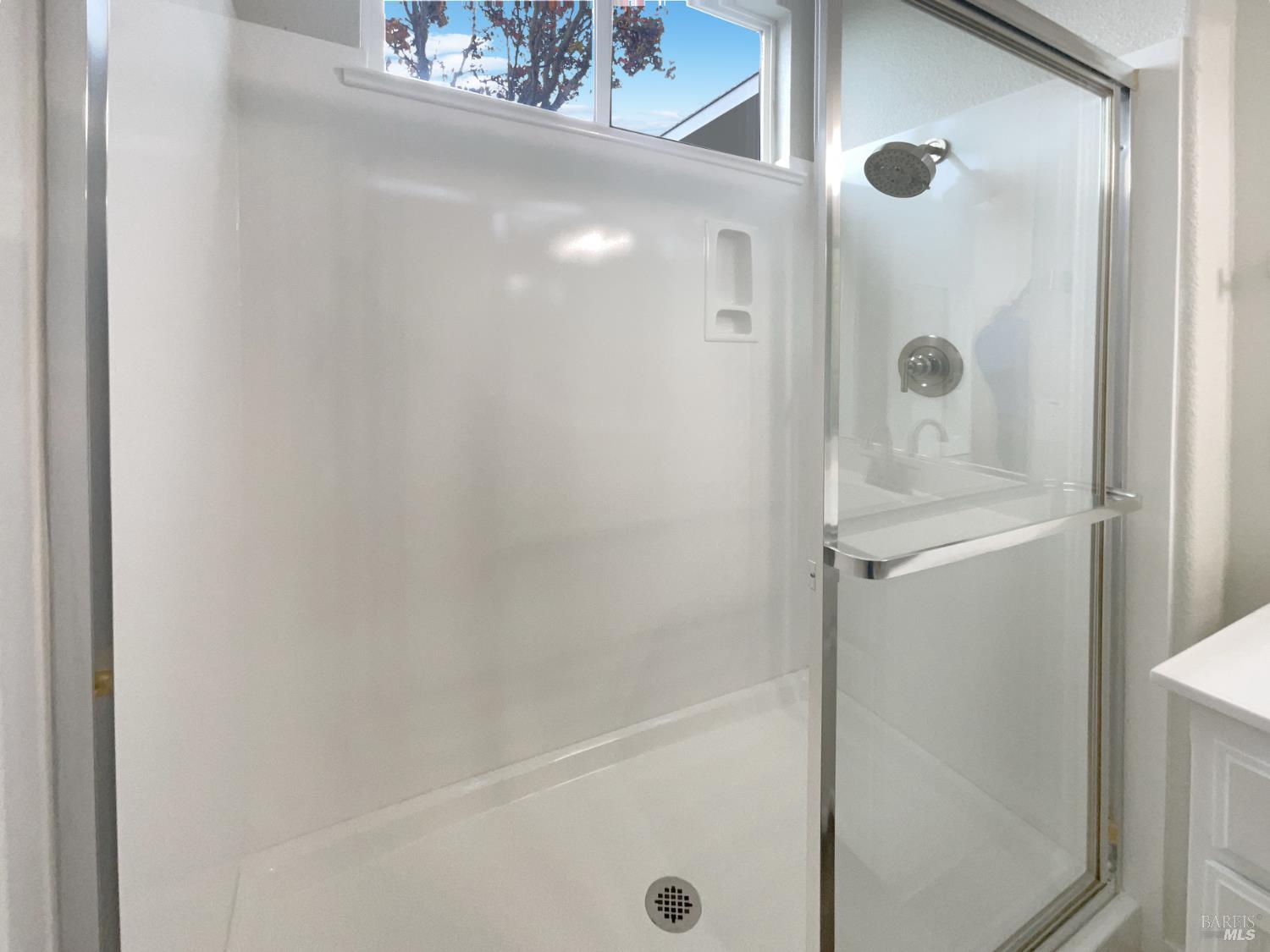 971 Bridgeport Way Rio Vista, CA 94571 - Photo 17 of 39 a bathroom with a glass shower door