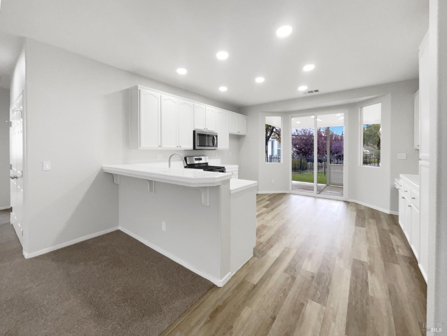 971 Bridgeport Way Rio Vista, CA 94571 - Photo 9 of 39 a view of kitchen with wooden floor and electronic appliances