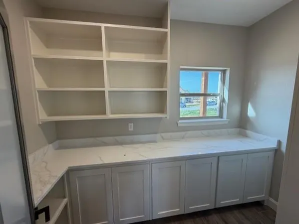 a room with cabinets and window