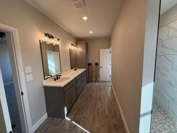 a bathroom with a sink a mirror and a toilet