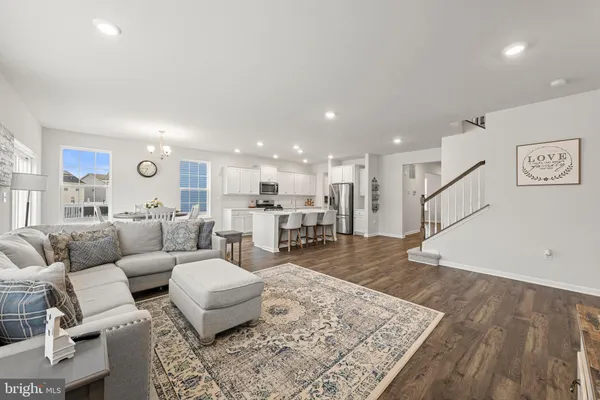 a living room with furniture and a rug