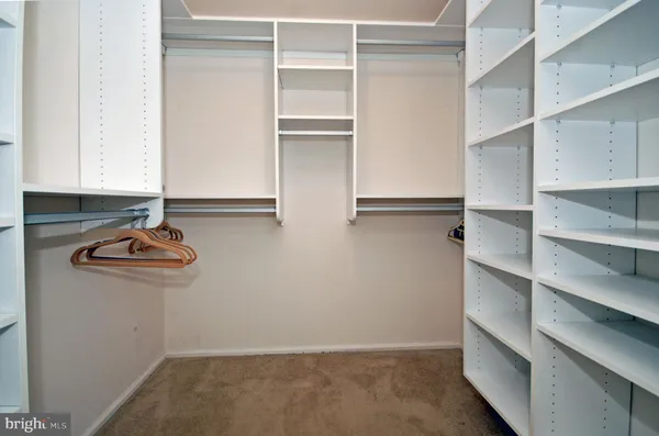 a view of cabinets and with walk in closet