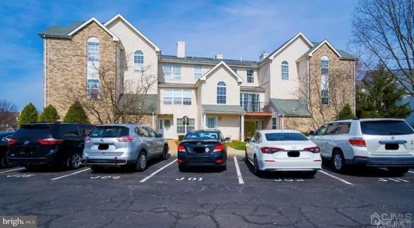 a view of a car parked in front of a house