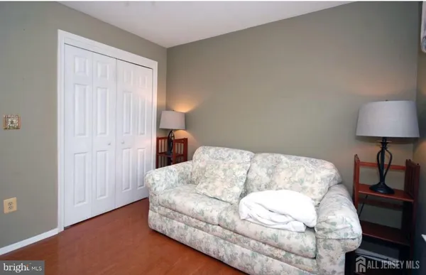 a bedroom with a bed and a lamp