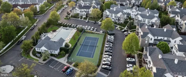 an aerial view of a house with a swimming pool