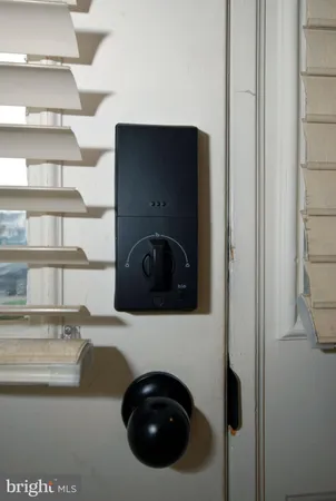 a utility room with washing machine and racks