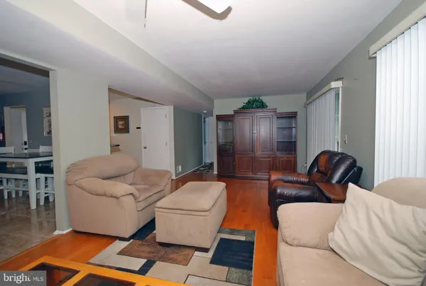 a living room with furniture and a rug
