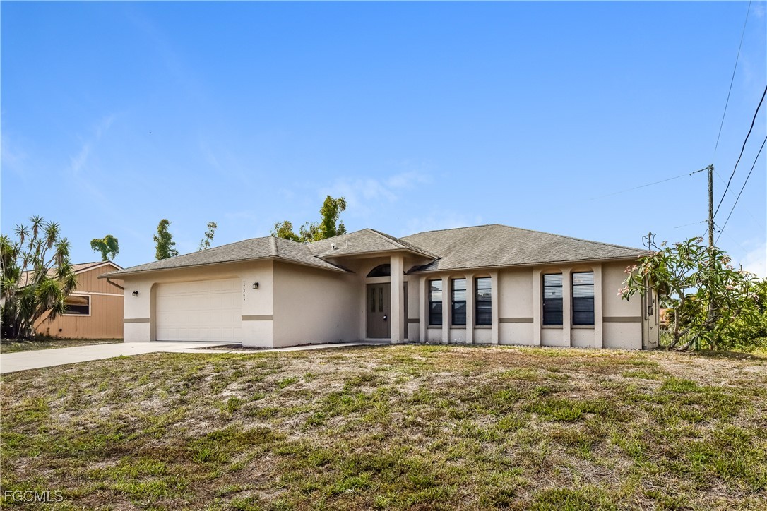 17365 Castile Road Fort Myers, FL 33967 - Photo 2 of 16 a front view of a house with a garden