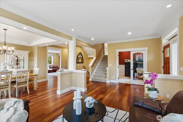 a living room with furniture dining room and wooden floor