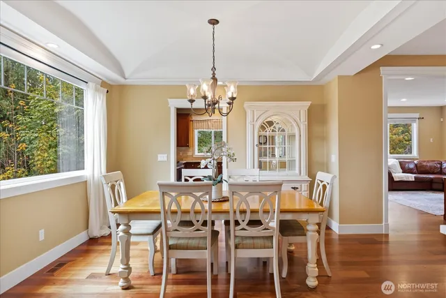 a view of a dining room with furniture window and wooden floor